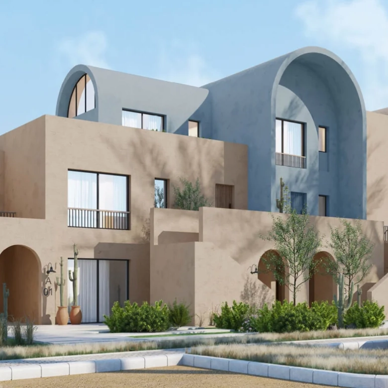 Residential buildings at Kamaran El Gouna surrounded by landscaped greenery and water features