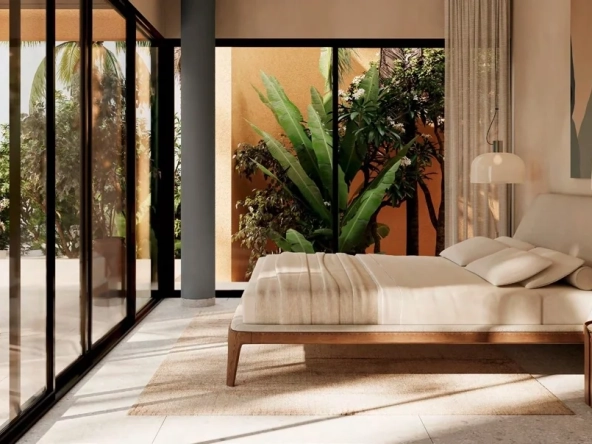 Modern bedroom at Tuban El Gouna with garden views and natural light